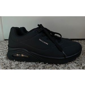 All black “Stand on Air” Skechers sneakers with rose gold accents